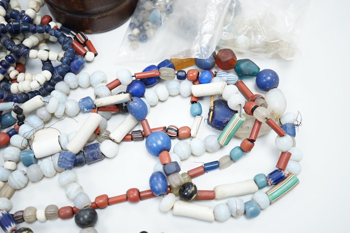 A pair of Turkish bath shoes, a collection of African beads and Middle Eastern vessels etc.